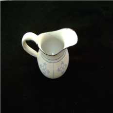 Brinquedo; leiteira